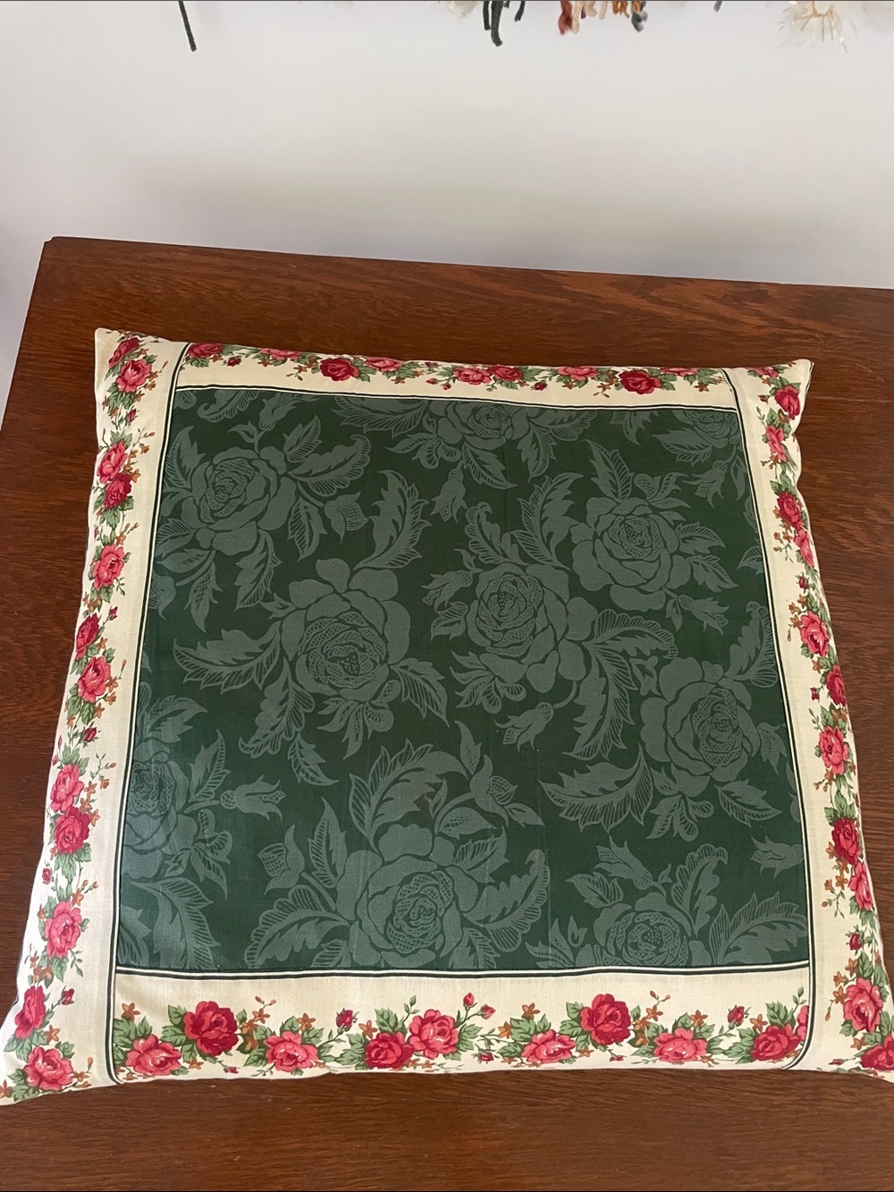 Vintage green floral pillow trimmed with flowers